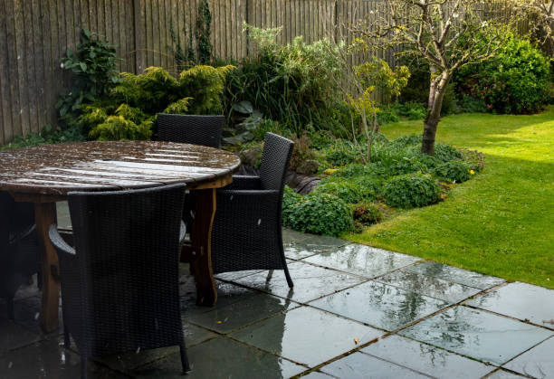 A light dusting of snow on a Garden table.